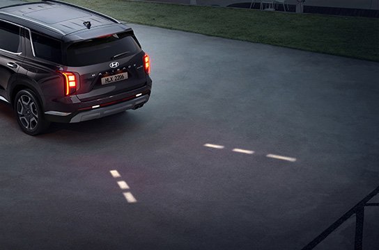 Кері қозғалыс туралы ескертетін бағыттаушы шамдар